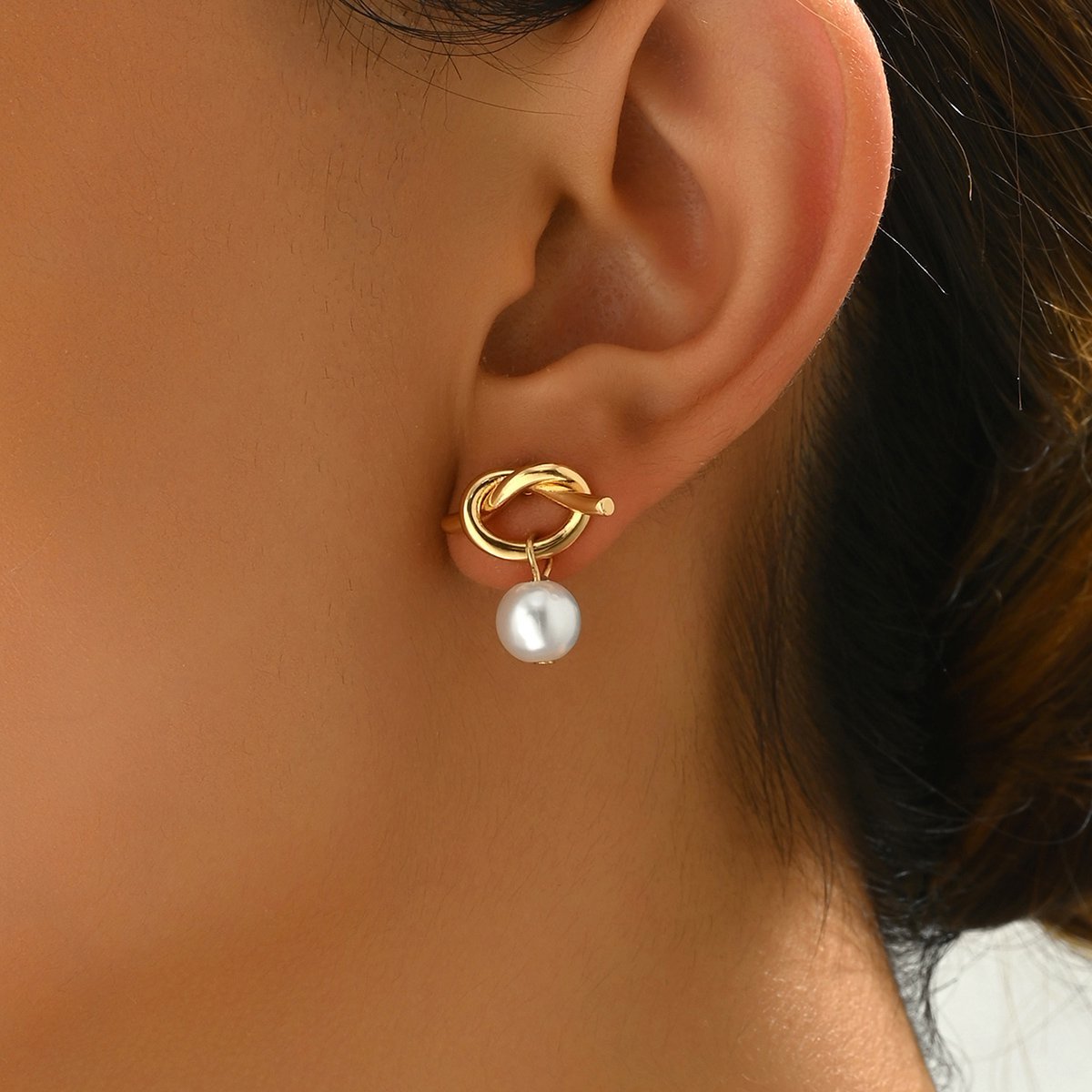 Elegant Gold Knot Stud Earrings With Pearl Drop